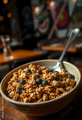 Bowl of granola with bluebe...