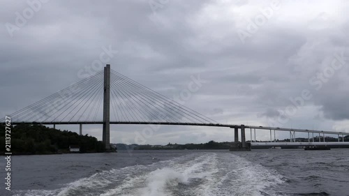 Nordhordland Bridge over Salhusfjorden fjord, view from speedboat or cruise ship.