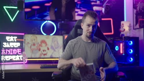 Anituber influencer reviewing comic book streaming from anime geek neon room