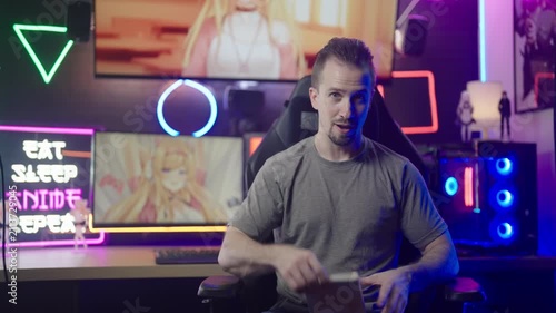 Anituber influencer reviewing comic book streaming from anime geek neon room