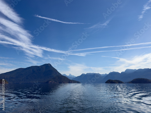 View of mountains across the water on a summer day