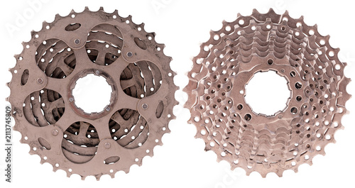 A metal bicycle freewheel gear shown from both sides on an isolated background.