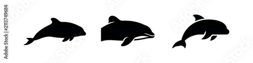 Foto Playful dolphin silhouettes jumping and swimming