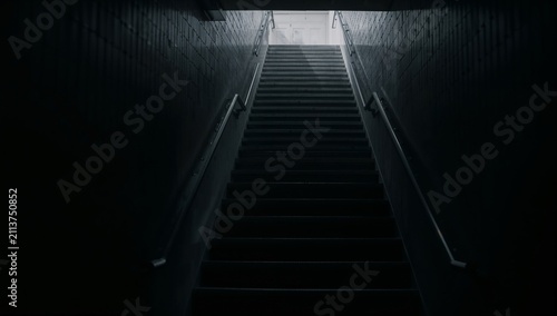 Steps Leading Upwards in a Dimly Lit Corridor Near the Entrance