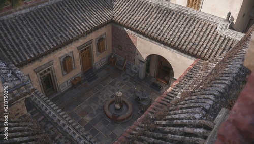 Detail of a Courtyard With Stone Walls and Potted Plants in a Historical Buil...
