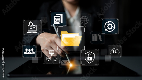 Принти на полотні Business Professional Using Digital Tablet with Cloud Storage Icons and Data Management Symbols for Modern Workflow Solutions