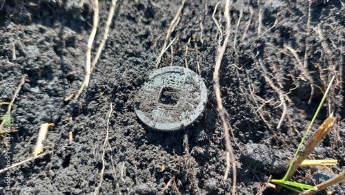 Ancient Coin Unearthed in Soil