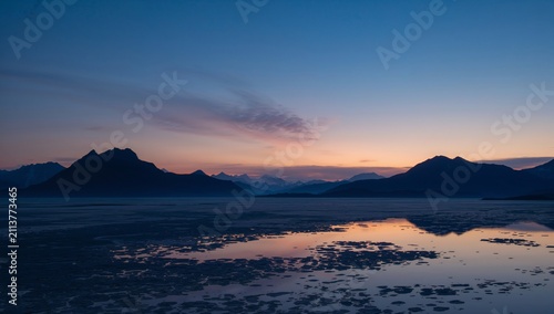 Sunset Over Mountains and Water in Alaska During the Evening
