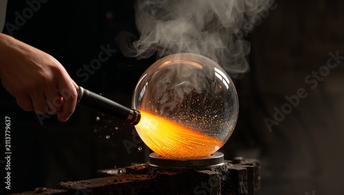 Glass Blowing Process in a Workshop With Flames and Smoke