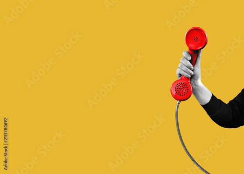 A woman's hand holds a red landline telephone. with copy space for individual text. Flat design art.