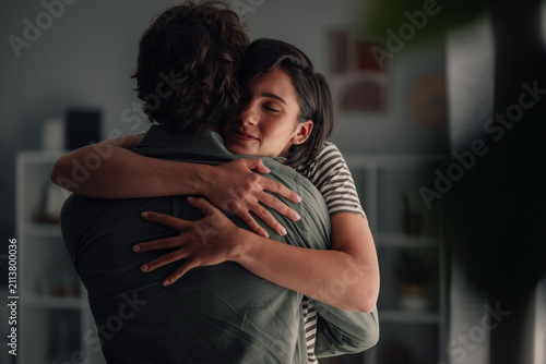 Konstfotografi Young woman embracing man in intimate moment, showing love and emotional support
