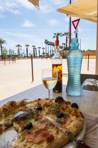 Eating a pizza in Port Barcarès, Occitanie region - France