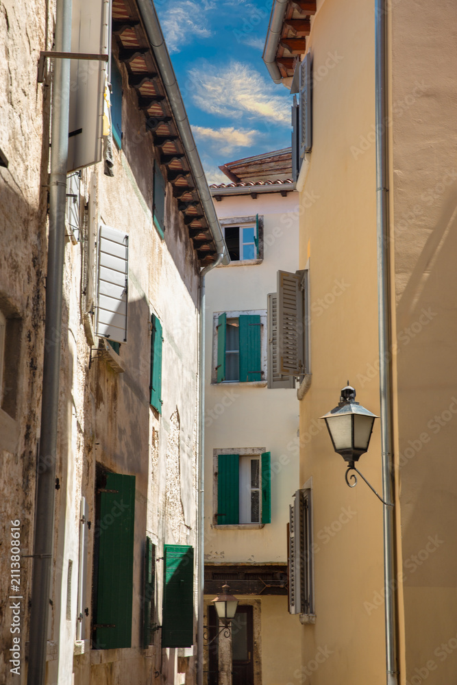 Fototapeta premium Narrow street in old town Rovinj, Istria, Croatia.
