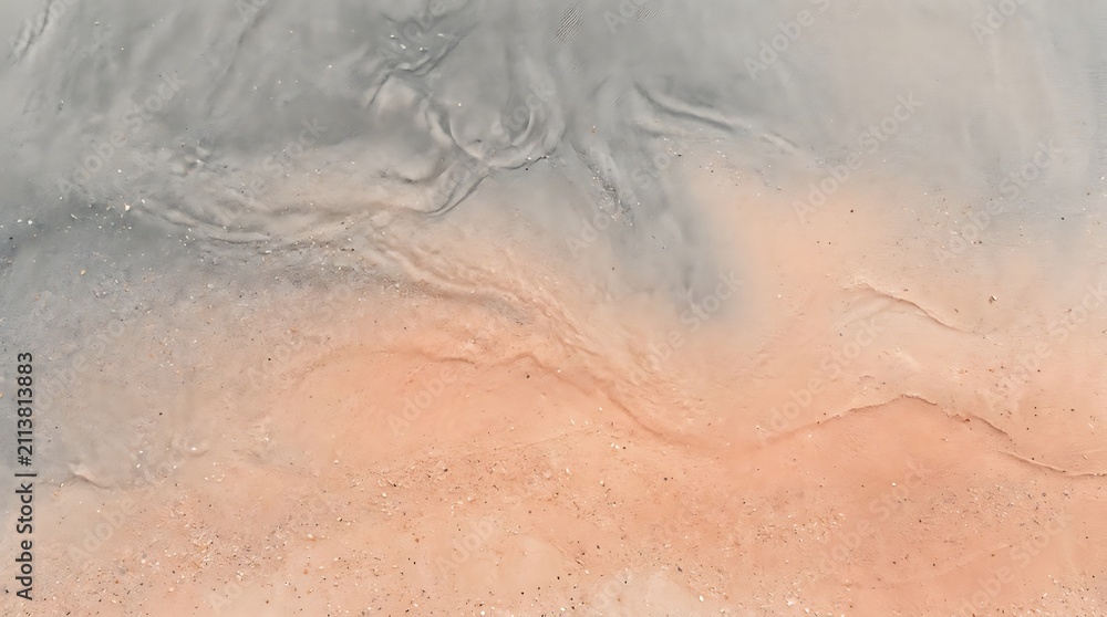 Fototapeta premium A close up view of a rough textured surface featuring a blend of grey and orange tones