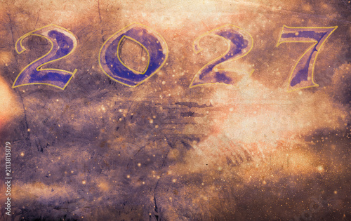 Numeric year 2027 displayed on a textured holiday night sky background with sparkles