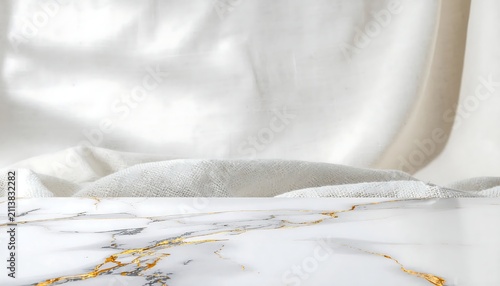 Elegant white marble texture with gold veins and soft fabric background