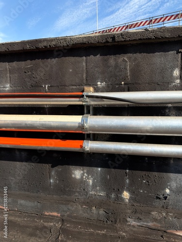 Electrical Metal Conduit Installation on Commercial Rooftop with Blue Sky