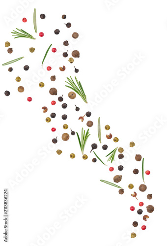 Colorful peppercorns and fresh rosemary needles scattered freely diagonally