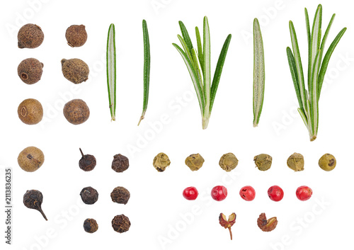 Fresh green rosemary sprigs and dry multi-colored peppercorns