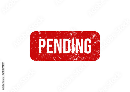 фотографія A red rectangular rubber stamp with the word pending written in white text isolated on white background