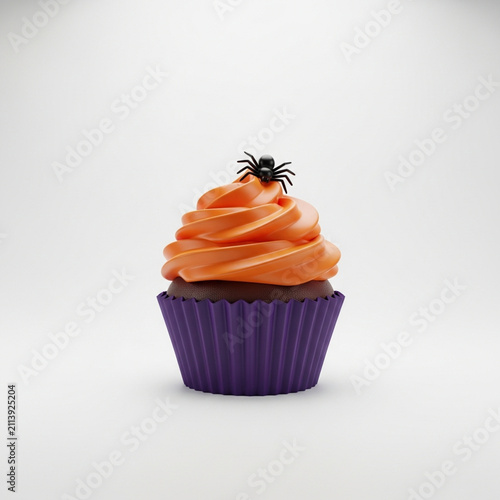 Halloween cupcake with orange frosting and spider decoration