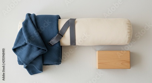 Yoga Still Life: Bolster, Blanket, and Block in Serene Arrangement, Studio Shot