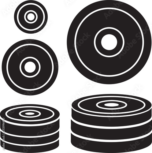 Weightlifting plates collection featuring various heavy discs for gym training.