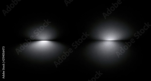 Two abstract, glowing light sources cast bright reflections on a dark, textured surface
