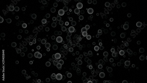 Foto Abstract black background with scattered white bokeh circle outline shapes and o
