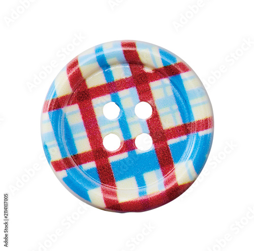 Round plaid pattern sewing button with four holes isolated on white background
