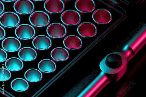 Close up of textured metal surface with circular indentations under colorful lighting
