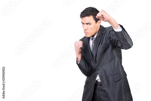 Serious worker standing in boxing stance and clenching fists