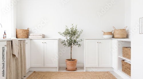 Modern laundry room with white washing machines wooden shelves and woven baskets