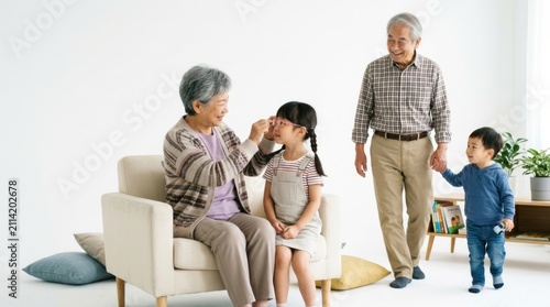 Happy asian family with grandparents and kids at home
