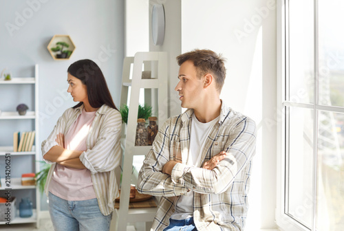 Cuadro en lienzo Offended family couple at home feeling sad and angry after a quarrel