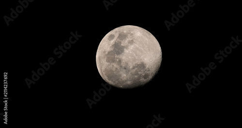 Canvastavla Full moon shining in a clear black night sky showing detailed lunar craters and surface texture