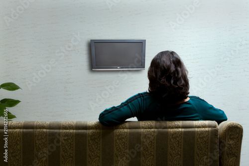Obraz na płótnie Girl sitting on a couch