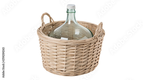 Foto Large vintage glass carboy bottle inside white wicker basket isolated on transpa