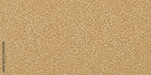 Quadro su tela Textured Sand Surface: A close-up shot revealing the intricate details of a fine-grained sand surface, showcasing its natural patterns and granular texture under warm lighting
