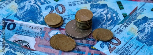 Hong Kong dollar money banknotes and coins on table. Hong Kong cash bills of HKD currency