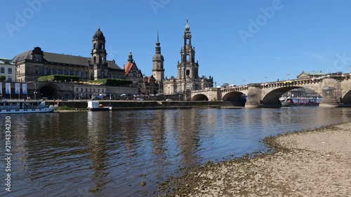City skyline of Dresden with Dresden Cathedral and Augustus Bridge in the Old Town, view from the shore of Elbe River in Saxony, Germany.