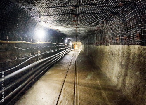 фотографія Underground old mine tunnel with railway, mining industry