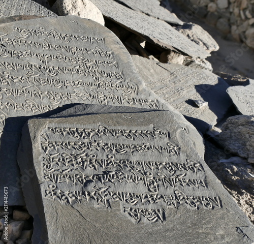 Mani stones, prayer stones with tibetan buddhist text carved in Ladakh.