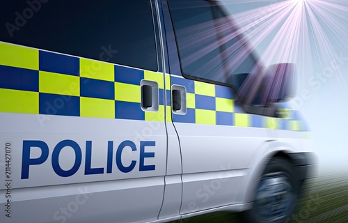 White police van with blue and yellow checkered stripe speeding on a bright day