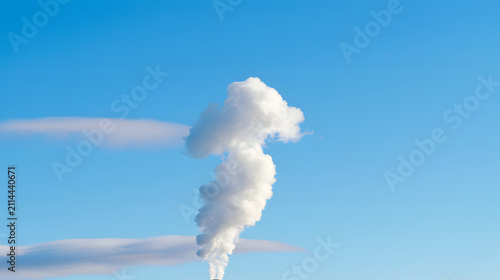 Steam plume rising in blue sky