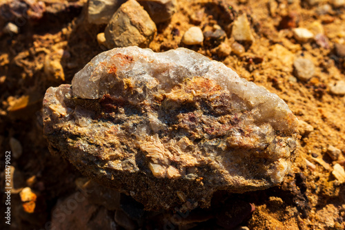 Картината върху платно Close-up of a raw granite pegmatite specimen featuring coarse quartz and feldspa