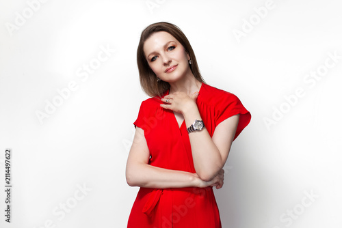Young girl in red dress. Isolated on white background.