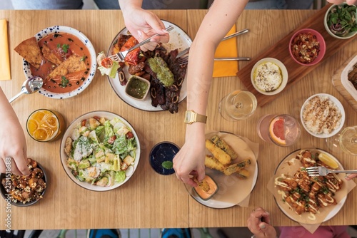 Bild auf Leinwand A diverse spread of colorful dishes captures a festive gathering at a trendy res