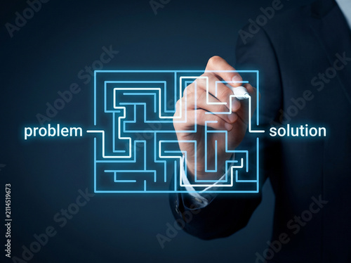 Businessman solving a maze problem. Strategy concept for finding business solutions.