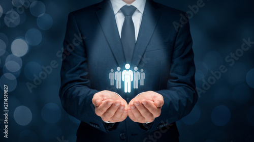 Businessman holding human resources icon. HR manager recruiting professional team members.
